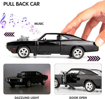 Black toy car with music, light effects, and open door feature, held by a hand.